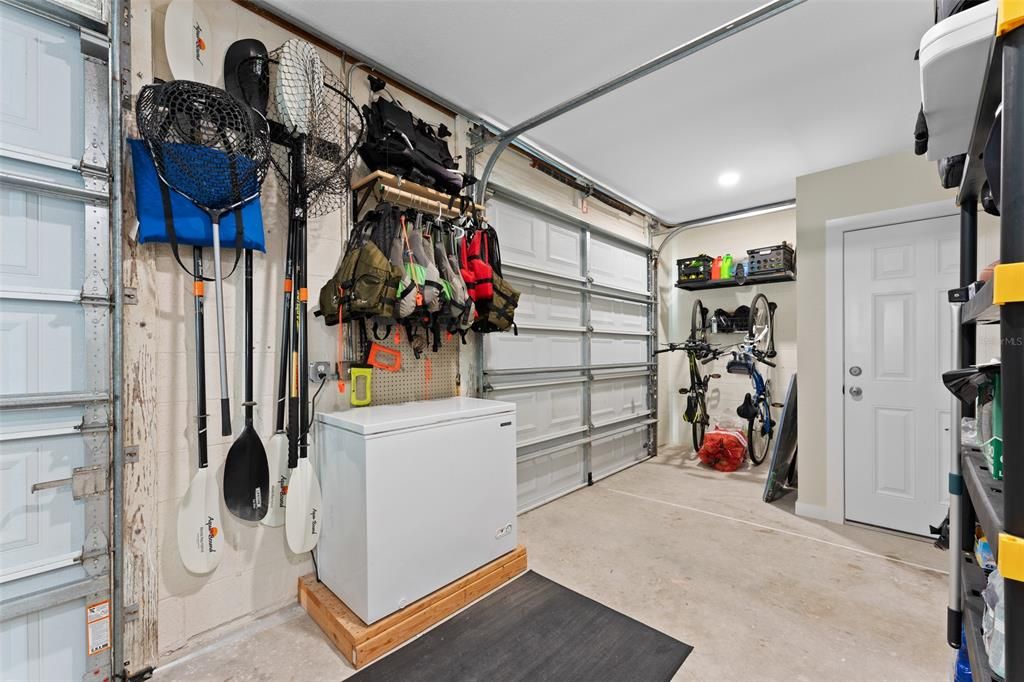 GOLF CART SIDE WITH AMPLE STORAGE. NOTE CEILING HEIGHT. TONS OF STORAGE FOR TOYS. YOU CAN HAVE A FREEZER FOR YOUR BAIT TOO!