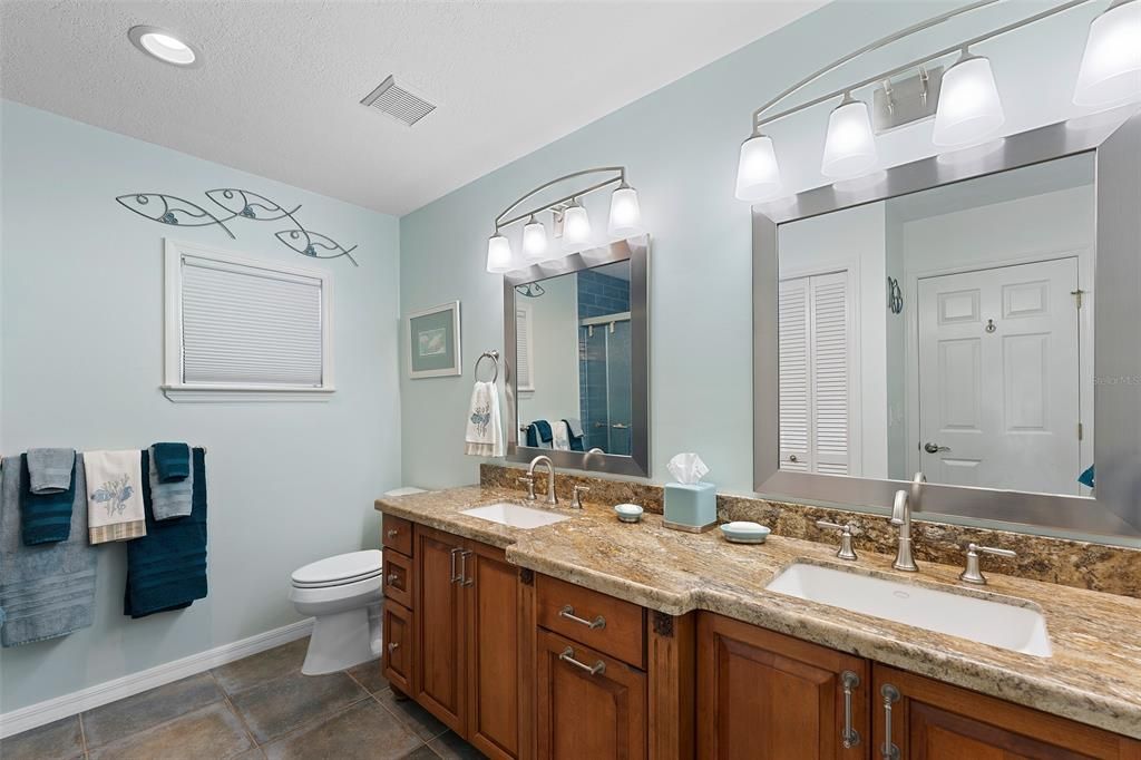 LOADED WITH DRAWERS IN THIS CUSTOM DESIGNED DOUBLE SINK VANITY. GORGEOUS GRANITE WITH UNDERMOUNT SINKS.