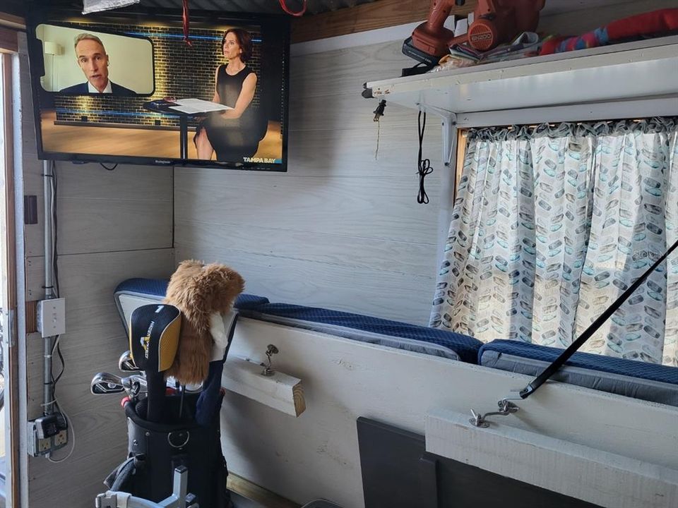 Watch TV while hanging out or working on a project in the outdoor shed