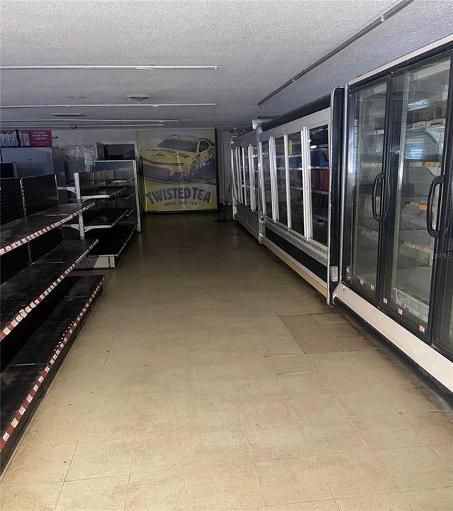RIGHT SIDE OF MAIN STORE AREA WITH  12 REFRIGERATION UNITS