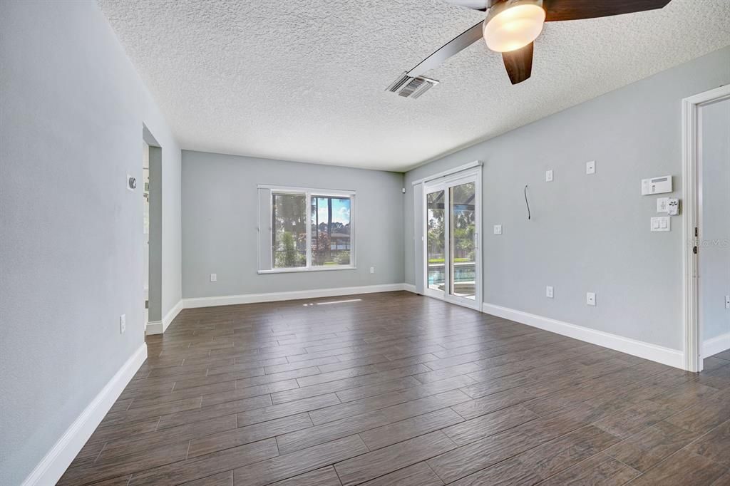 Master Bedroom. Split plan. Off the great room area. Double blackout shades on windows and sliders.