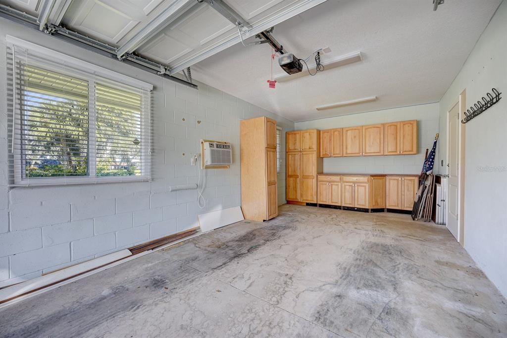 Small Garage w/built-ins. Additional AC unit. Room good as a workshop or craft room.