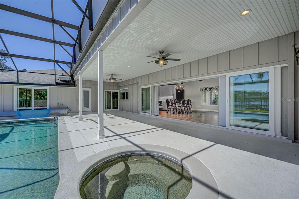 Hide-away Sliders looking into great room from the pool area. Really opens up the home. Screening has special Unobstructed View screening.