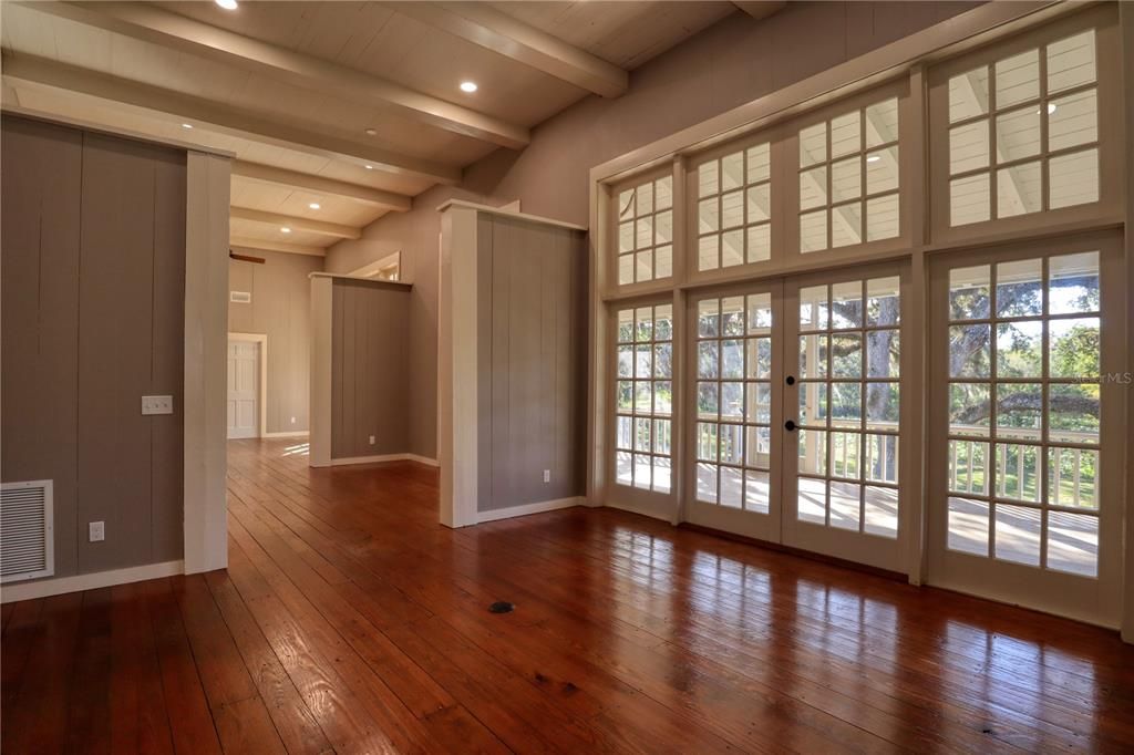 View from Family Room of Flex room and Living Room, Back Enclosed Porch and Pond