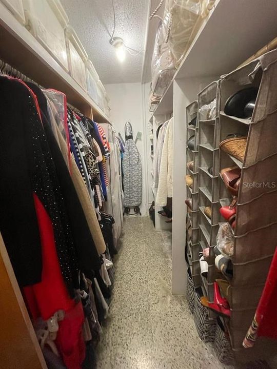 Walking closet at the room that is used as a primary bedroom