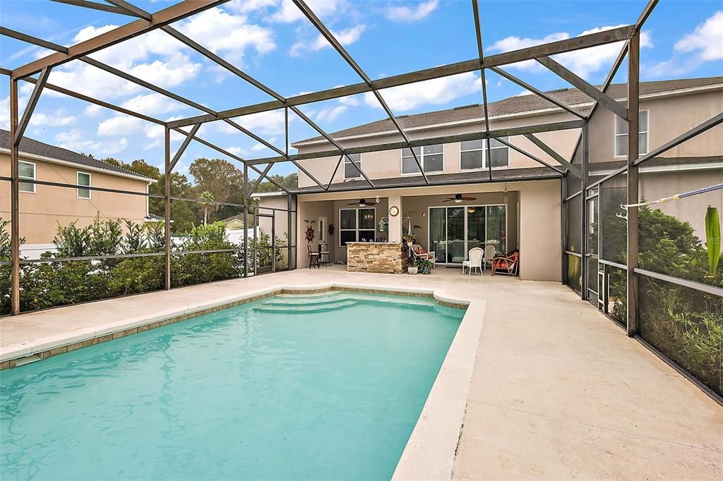 pool view to outdoor kitchen - screen enclosed