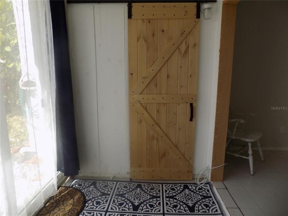 Enclosed Sunroom Porch toward Laundry closet.