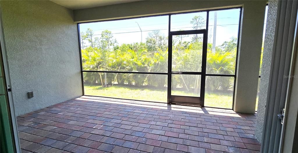 Screened rear lanai with bath access