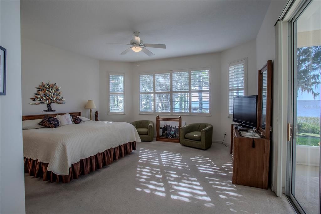Gorgeous, spacious Master Bedroom with amazing lake views and access to screened lanai and more lake views!!