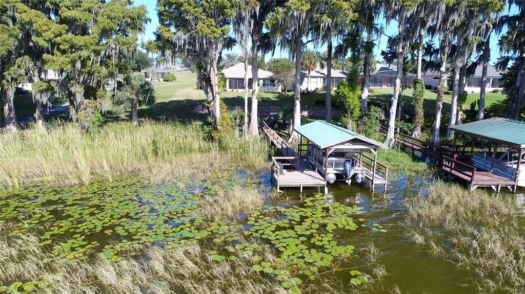 Your own private dock and covered boat lift on the gorgeous shore of Little Lake Harris on the Harris Chain of Lakes.  Great fishing, tournaments, and recreational boating.