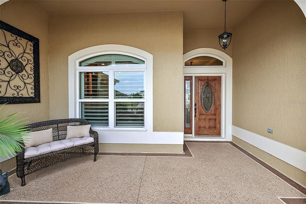 Front patio & covered entrance w/elegant leaded glass door