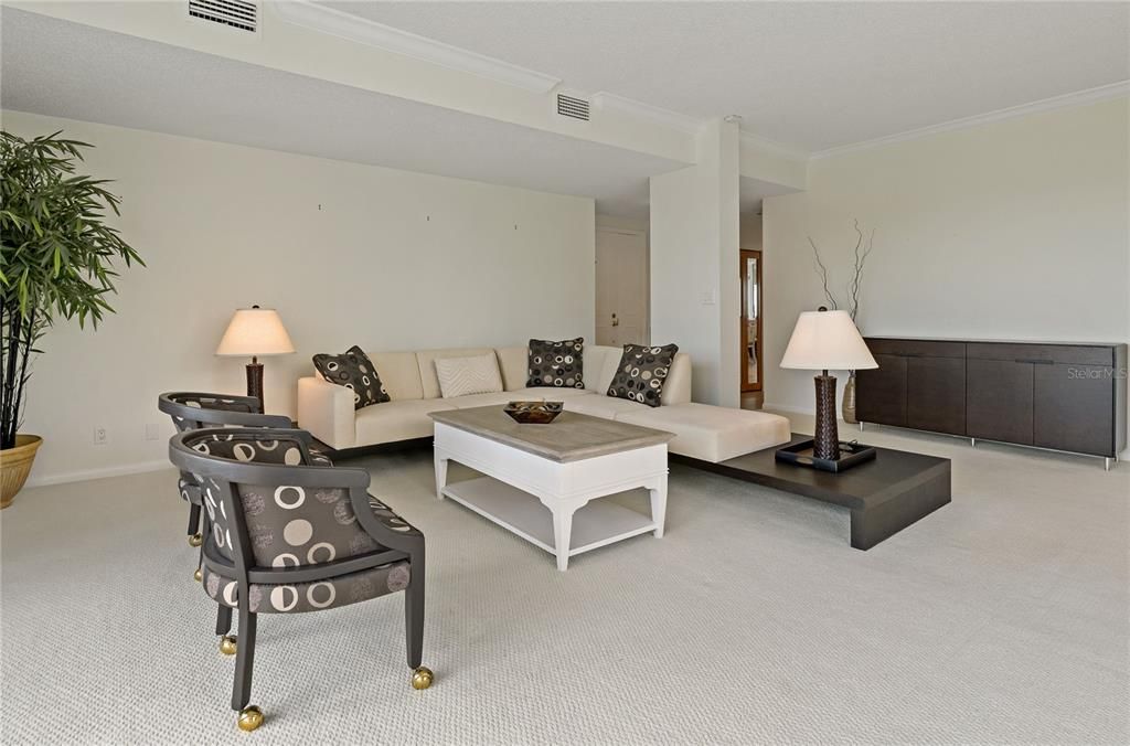 Spacious living room overlooking golf course