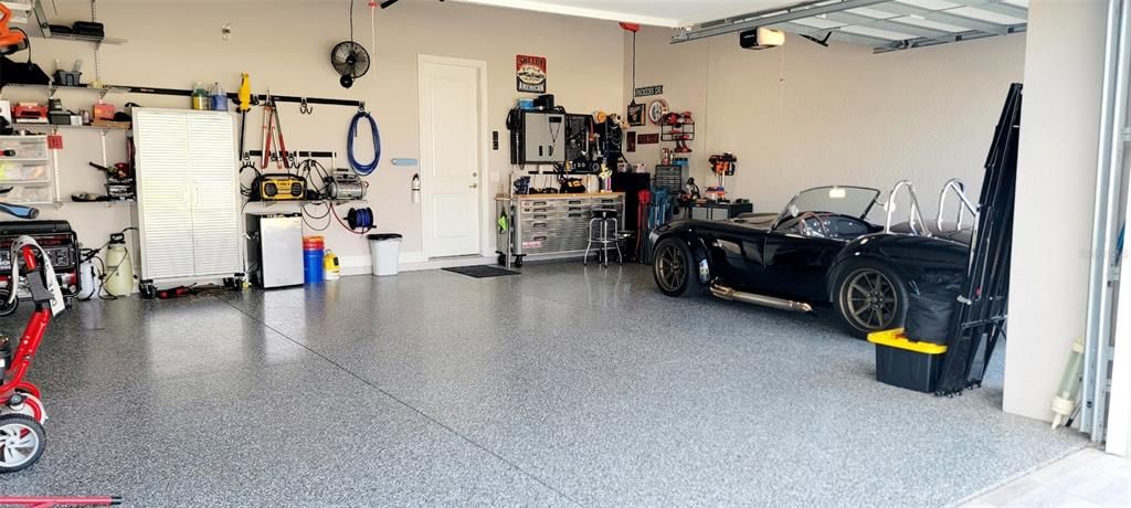 3 car garage with epoxy coated floors