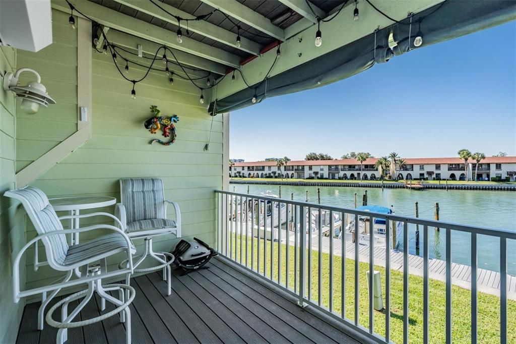 Second floor covered balcony with beautiful views of the canal and intracoastal waterway