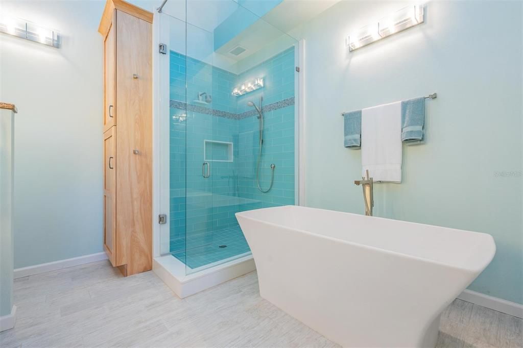 Master bathroom with custom walk in shower, double shower head, custom glass enclosure