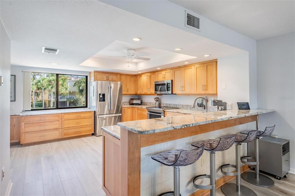 Completely remodeled chef's kitchen with maple cabinets, granite counter tops and breakfast bar