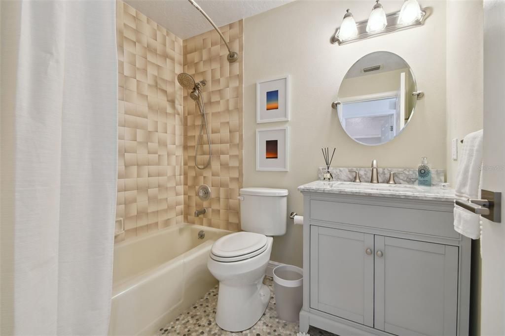 Guest bathroom with shower tub combination