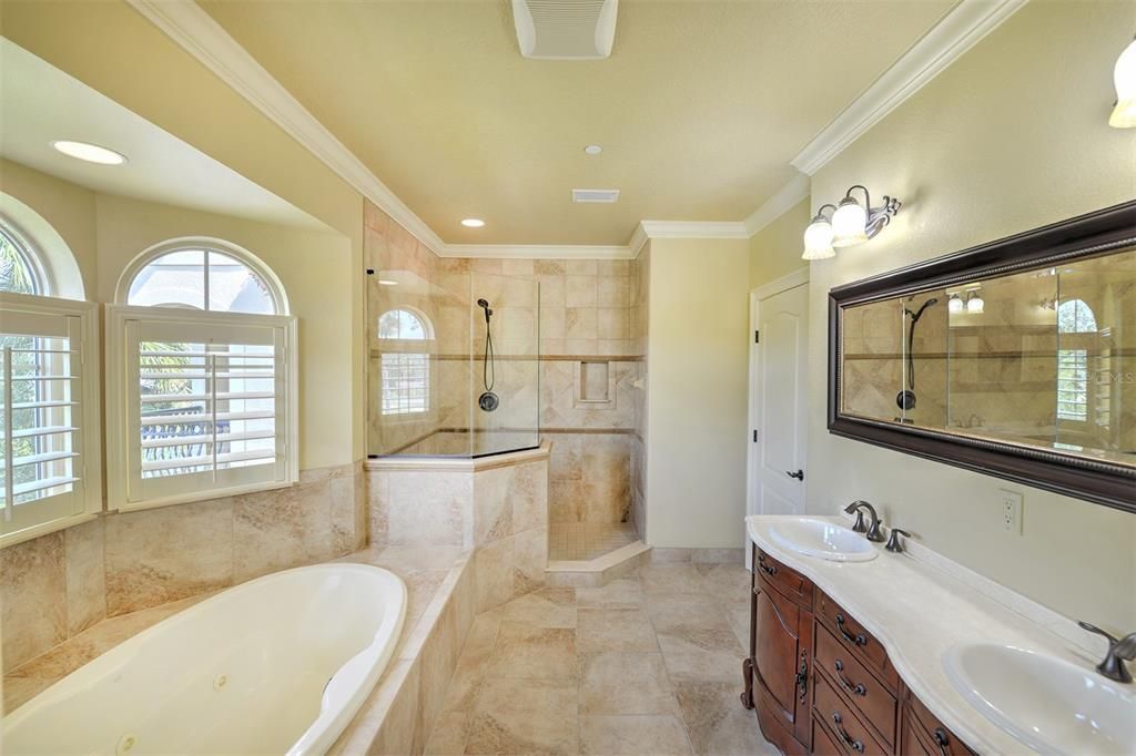 Owner's bath also includes a jetted tub, walk-in shower, and double vanities.