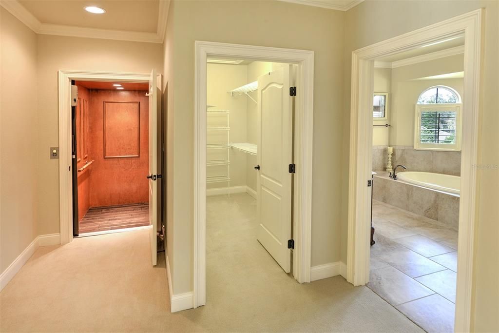 Owner's suite private elevator, walk-in closet, and bath.