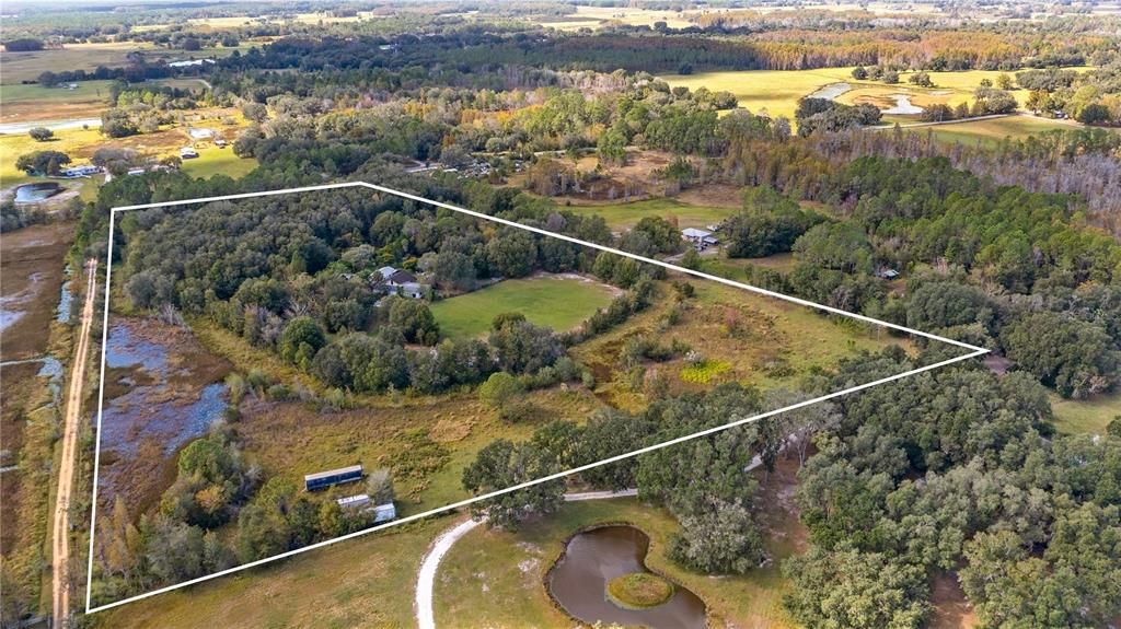 Aerial of 2610 Stephens Rd Groveland, FL 20acres and 5/2 home with HUGE outbuiding