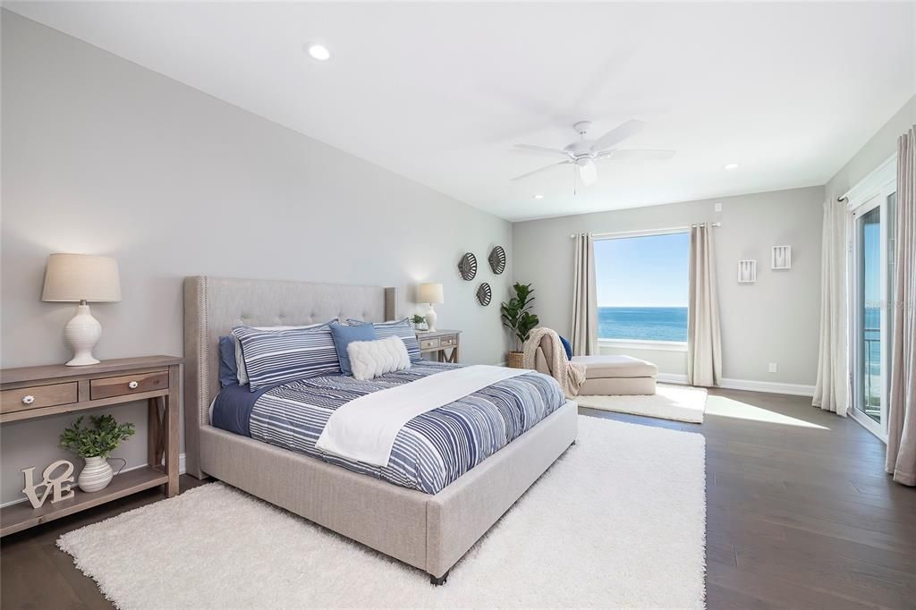 Located on the third level, this guest suite has access to the balcony, a large walk-in closet, private bath, and amazing beach views!