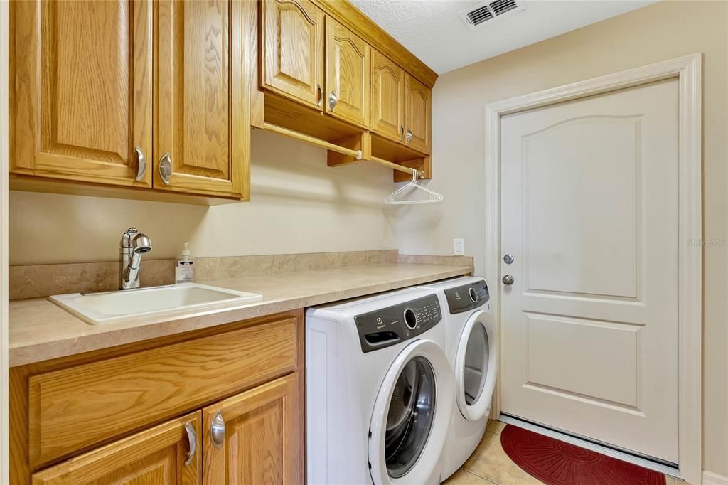 Large interior laundry with washer and dryer that conveys