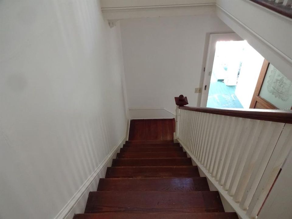 Looking down the staircase to the front door.