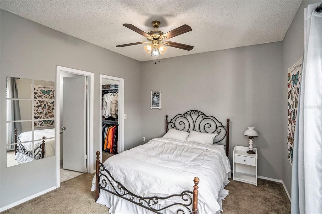 The master bedroom with a private bathroom and a walk-in closet