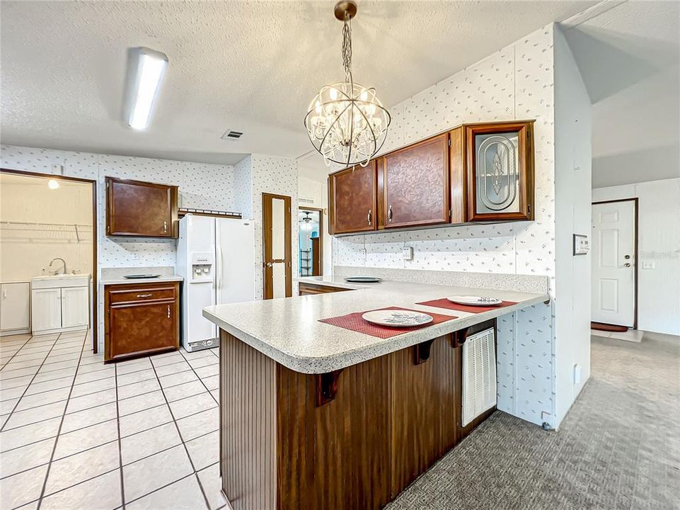 The laundry room is right off the kitchen.