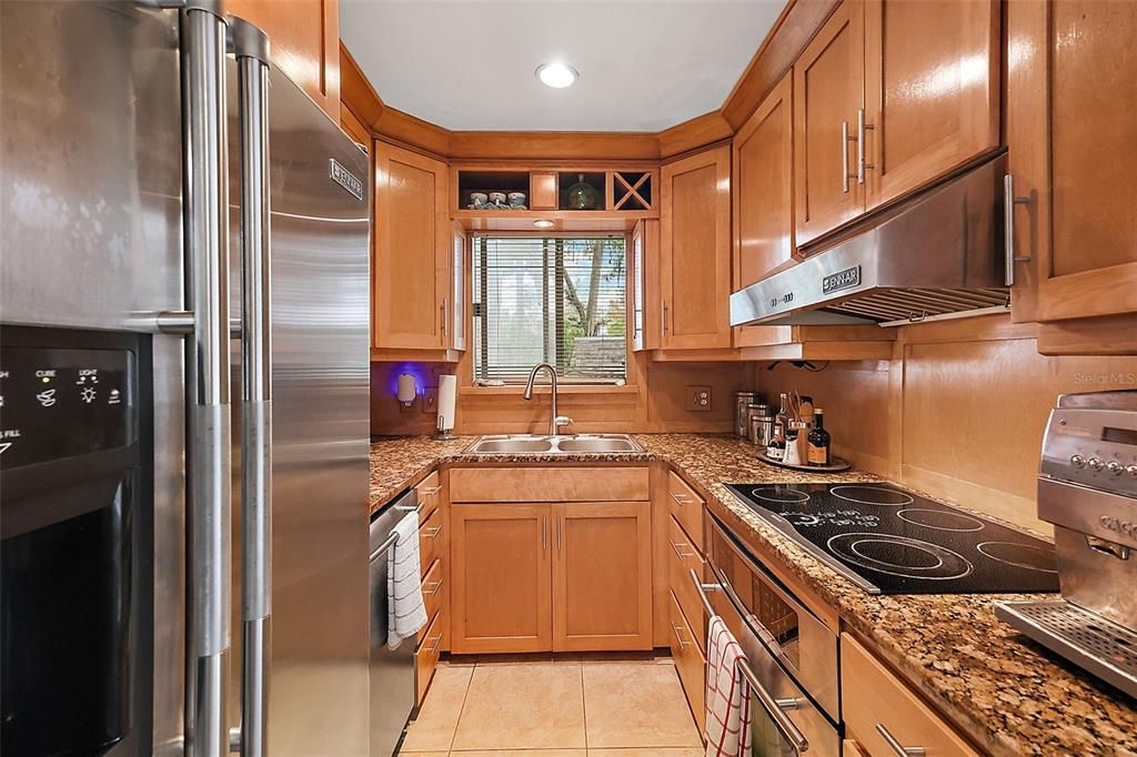 solid wood cabinets, granite countertops and Jenn Air appliances