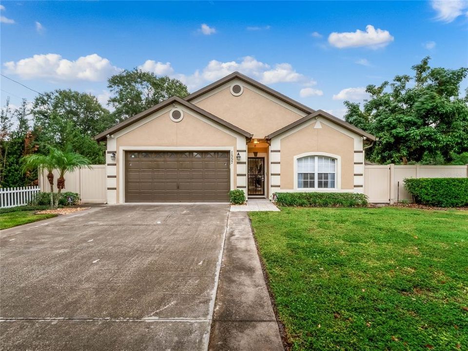 Unique opportunity to own a CUSTOM BUILT HOME on .86 ACRES with NO HOA, an expansive Florida Room (1000+ sq ft under air!), a DETACHED GARAGE/WORKSHOP in addition to the traditional garage and REMODELED KITCHEN all surrounded by a PVC FENCE with a double/drive through gate for all the privacy you could ask for!