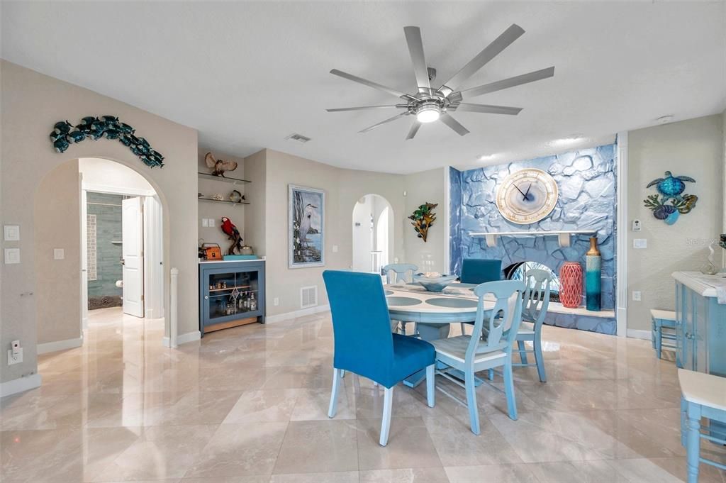 The dining room features a custom gas fireplace