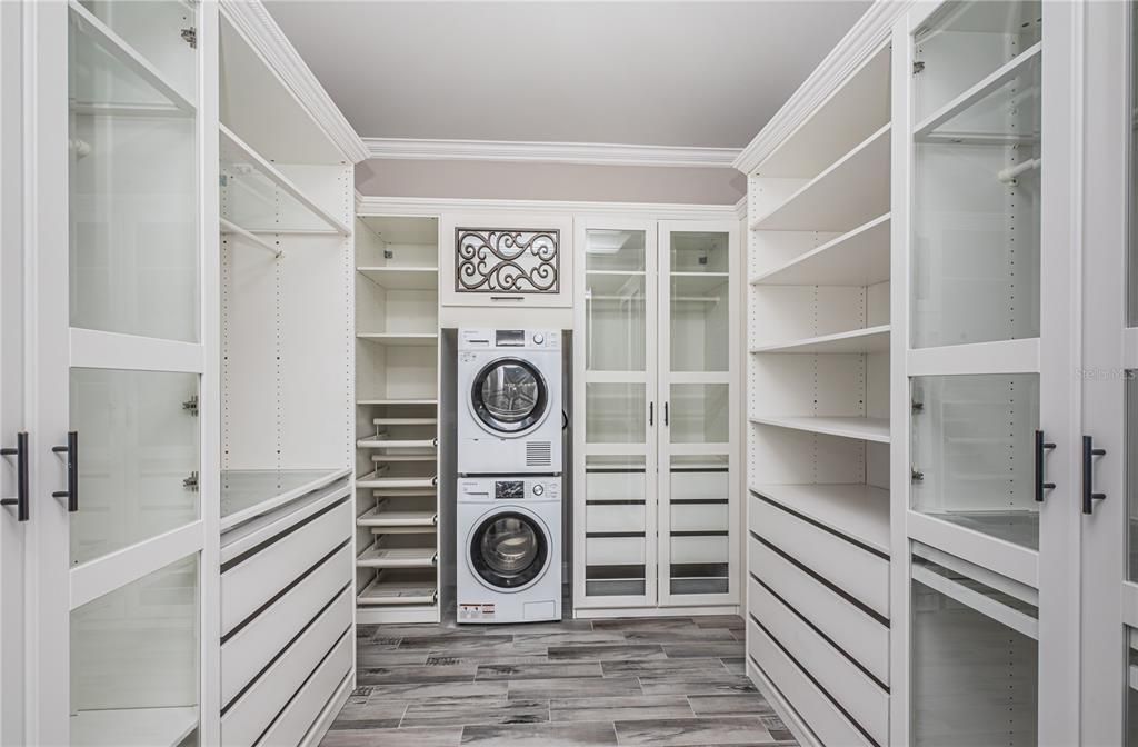 master closet with separate washer/drywer