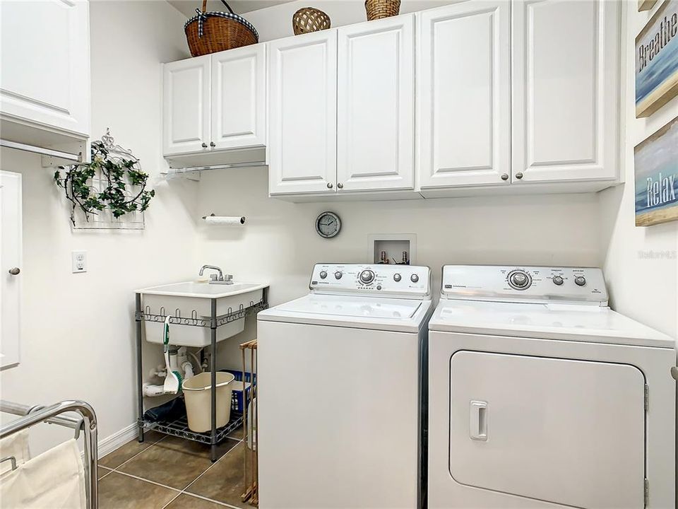 UPGRADED LAUNDRY ROOM W/UTILITY SINK AND STORAGE