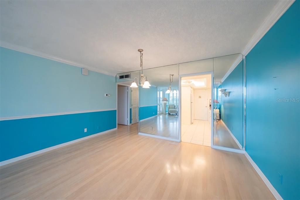 Door to primary bedroom on left.  Kitchen on right.