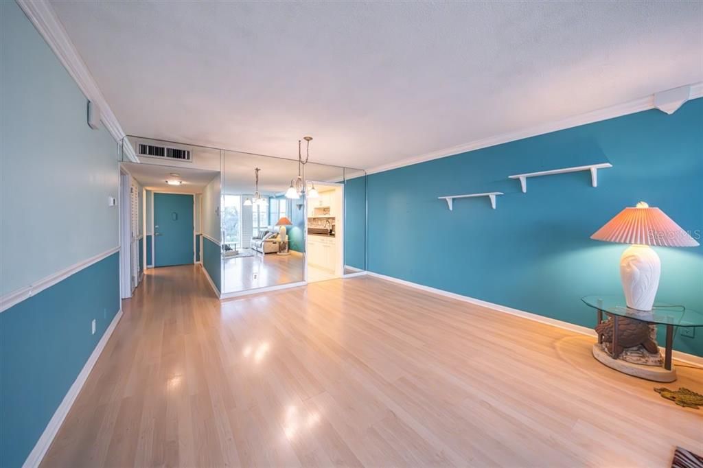 Living/dining room combo facing entrance and kitchen.