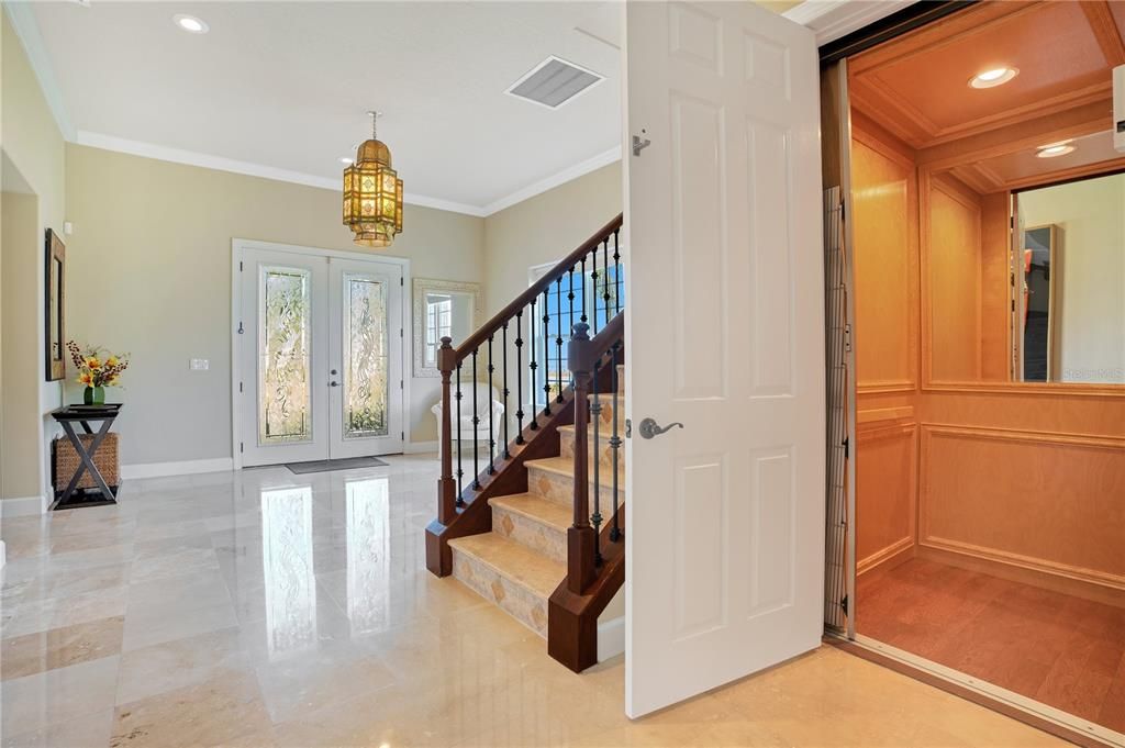 Elevator and stairs off the foyer
