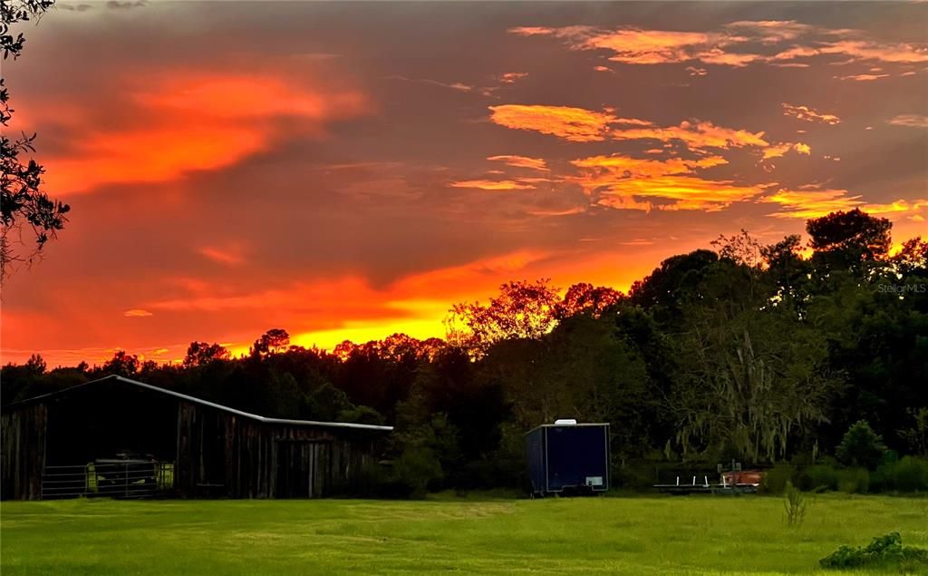 Sunsets over the barn and lush pastures