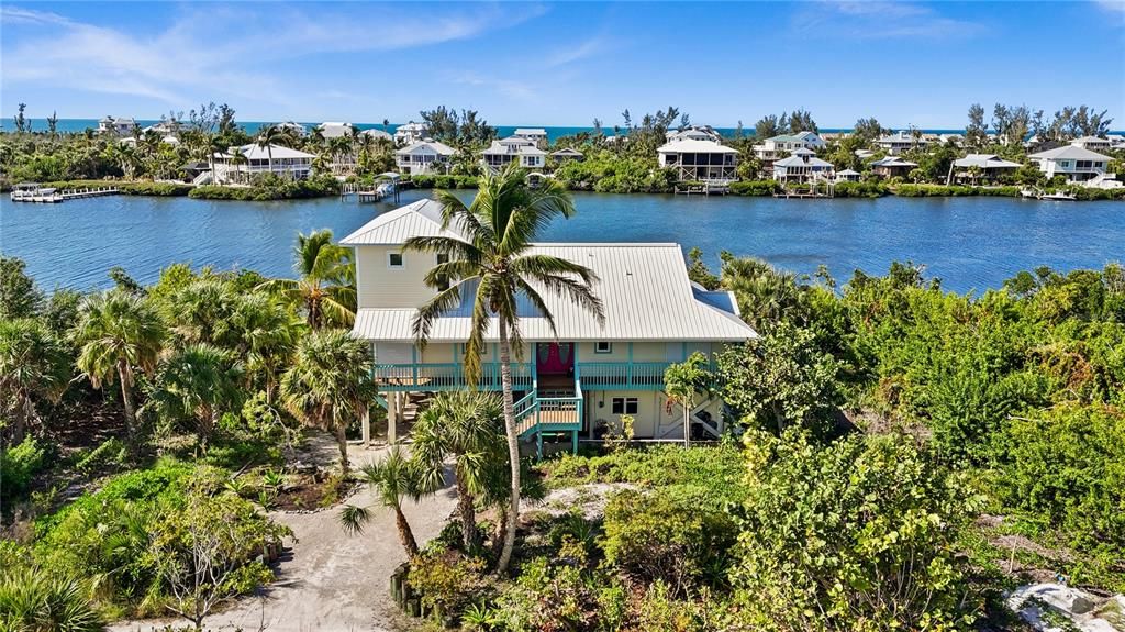 A beautiful waterfront Island Home with natural Florida landscaping.