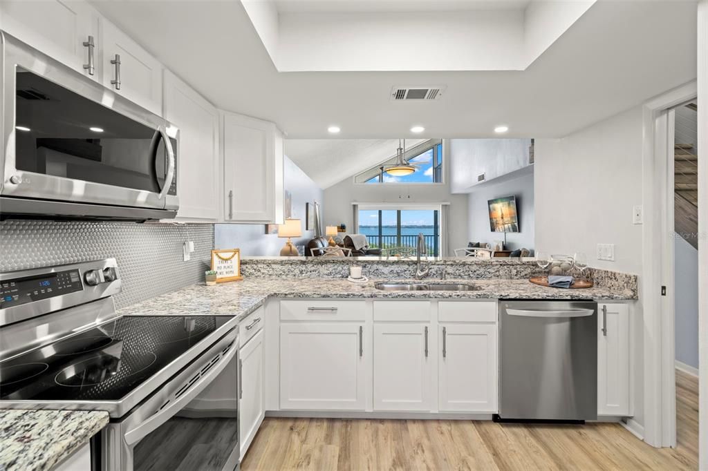 Kitchen with water views, large pantries, and washer and dryer closet