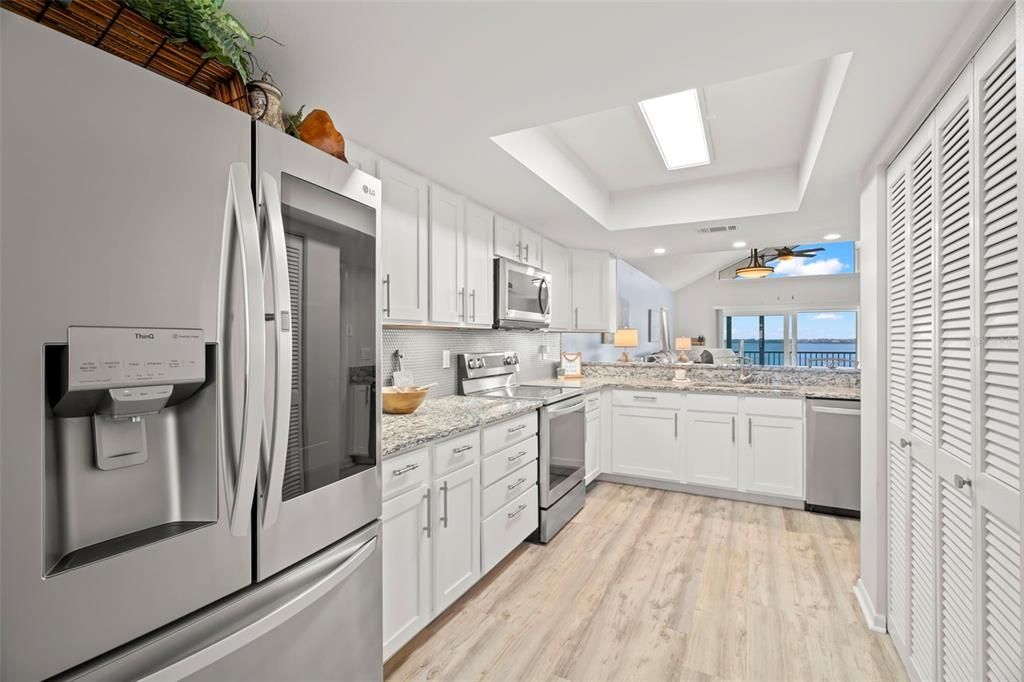 Kitchen with water views, large pantries, and washer and dryer closet