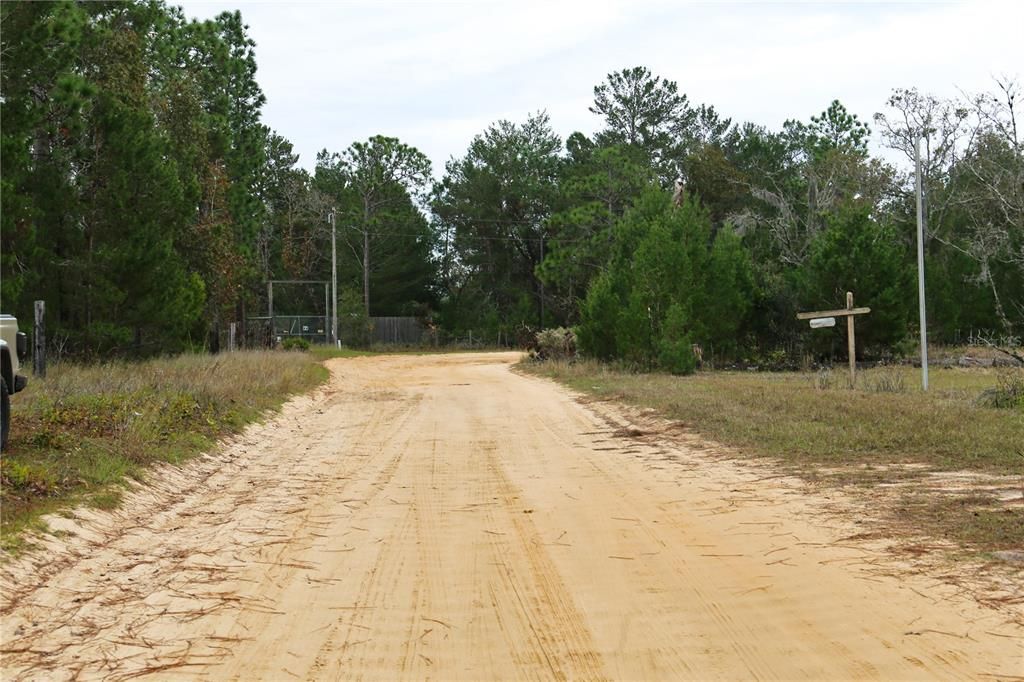 Property goes to the end of the road and around the curve.