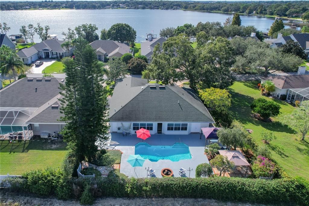 Aerial of the backyard with Lake Daisy in the back