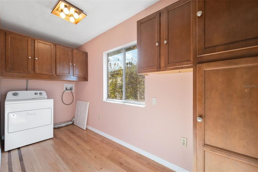 Laundry Room with storage cabinets