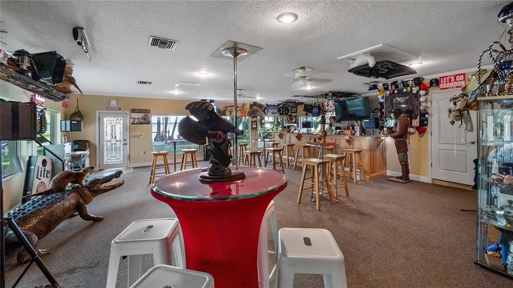 Large bar with granite counters, sink and amazing lake views