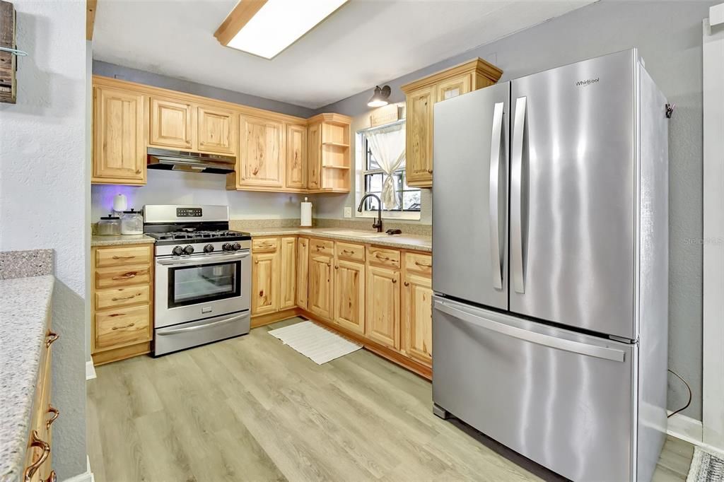 Kitchen w/ Hickory Cabinets.