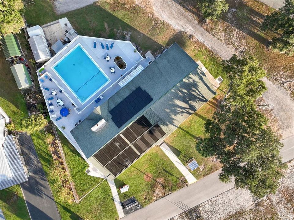 DRONE VIEW OF CLUBHOUSE & POOL