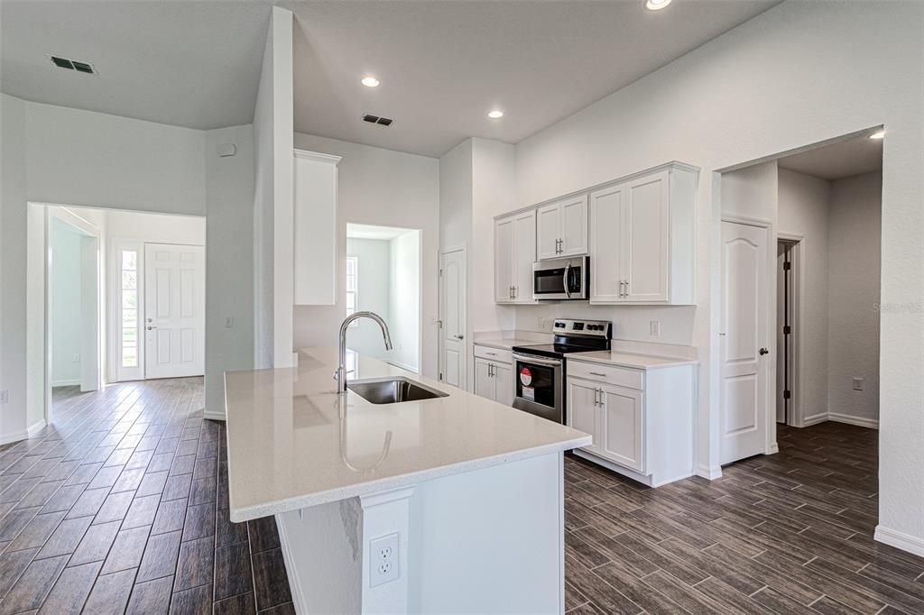 Kitchen with entrance to Laundry Room and Garage