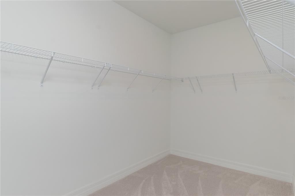 Walk-in Closet in Primary Bedroom/Bathroom