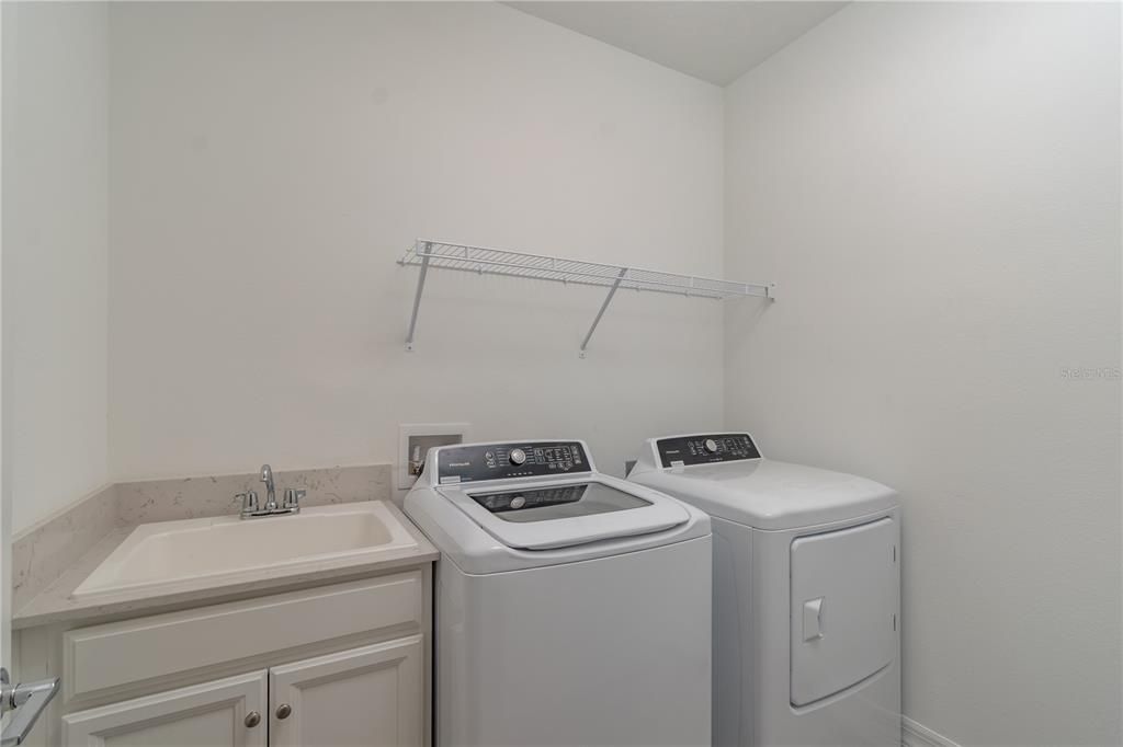 Laundry Room w/ Utility sink, Washer, & Dryer Incuded